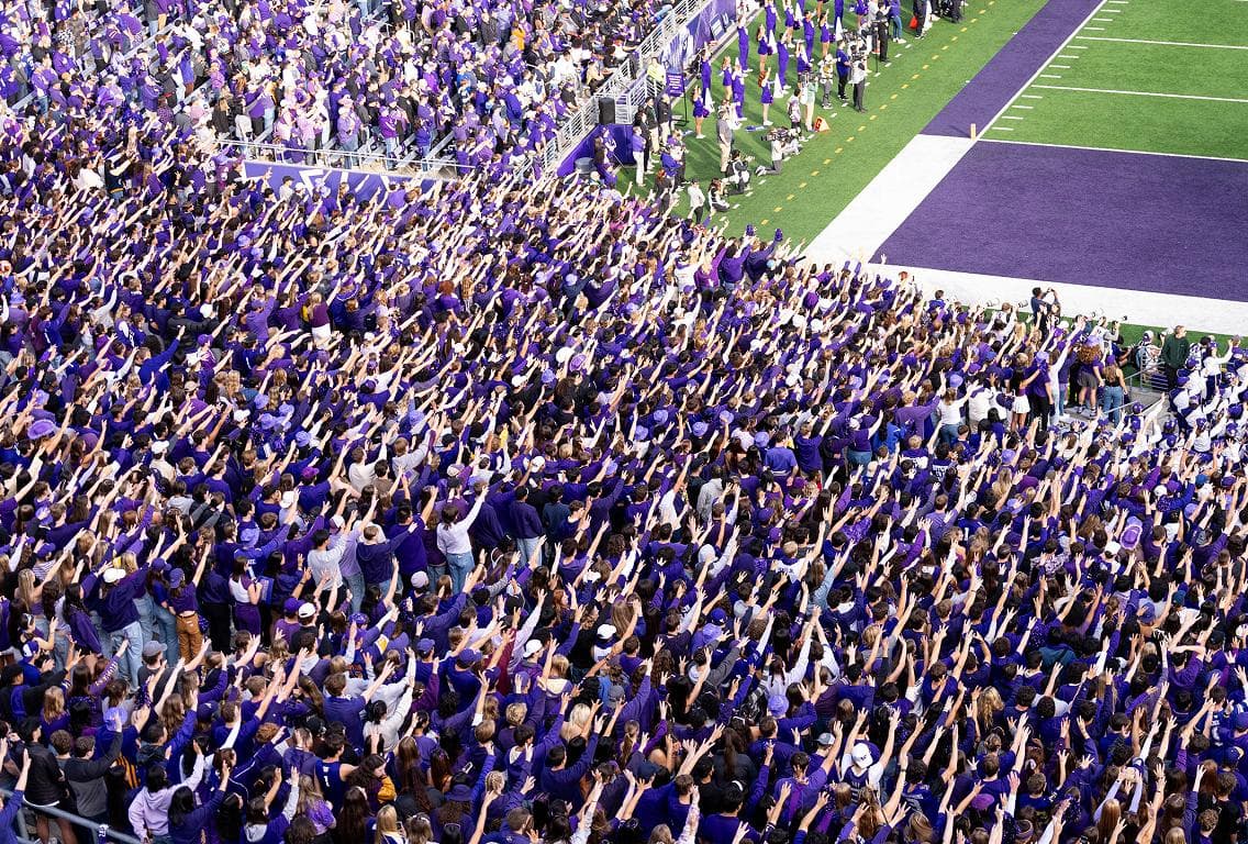 Group of Husky fans smiling